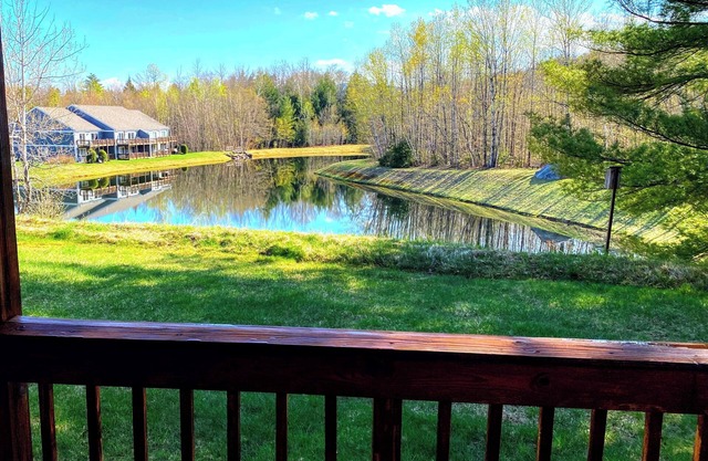 Serene pond views from this charming 2-bed White Mountains condo