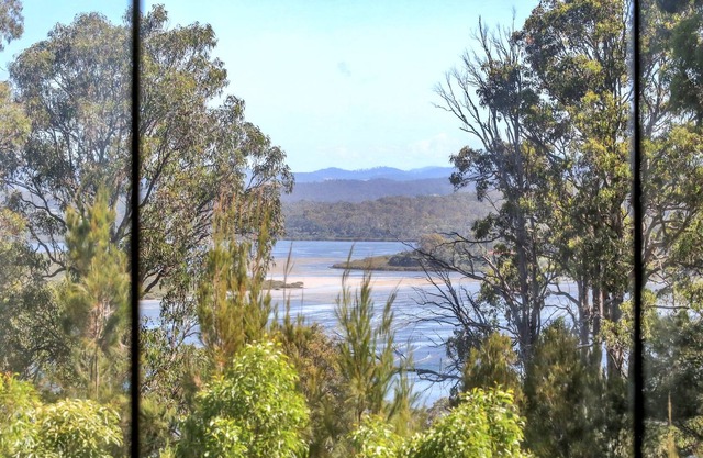 Set among the trees with lake views & just moments from Merimbula's beaches