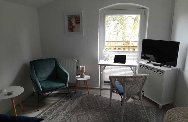 Small vacation apartment with balcony In the attic of a former farmhouse.