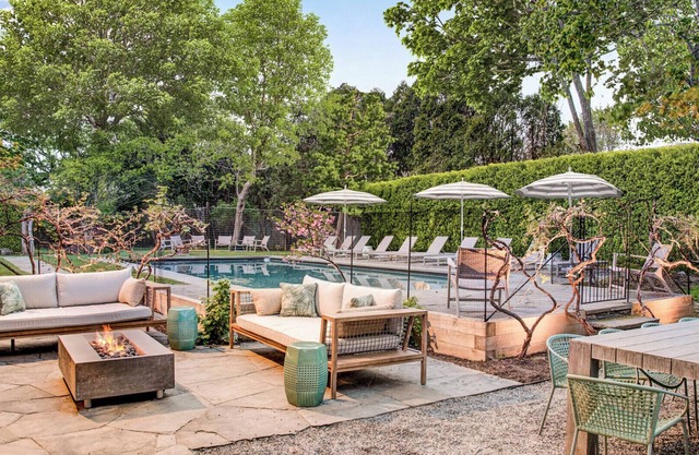 Southampton estate with oversized pool, chefs kitchen, vast lawn,.