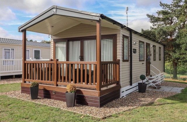 STAG LODGE, CARAVAN 70, with pool in Belton, Norfolk