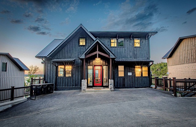 Stunning Mtn Cabin on Lake w/ 2 Stry Dock, Indoor Pool, Hot Tub, and Arcade Room