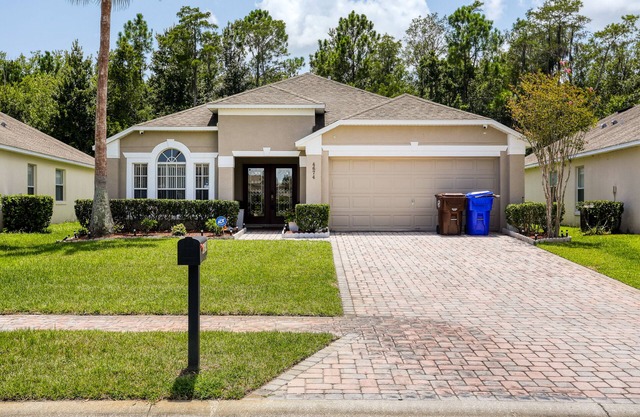 Stylish retreat with a private, heated pool, central AC, & garage game room