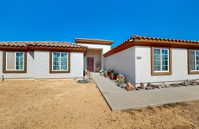 Sunny home with great backyard, home office, gym & convenient location