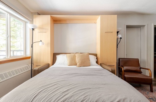 Super-Efficient Studio with Full Kitchen, Balcony & Smart Sleeping Options