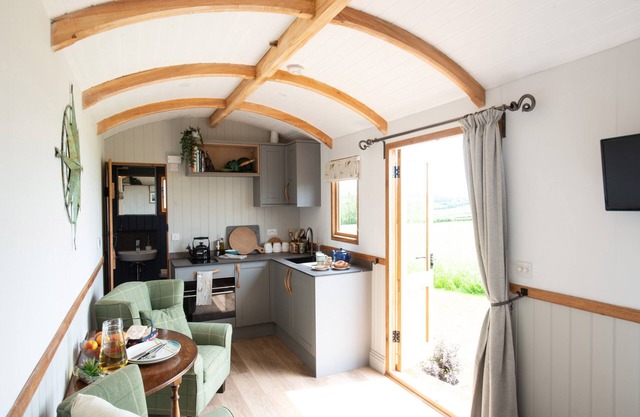 A bespoke handmade oak shepherd's hut, with a delightfully styled interior