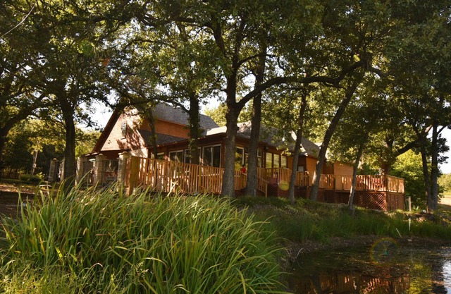 Tranquil Texoma Lake House w/ private lake on .5 acres & steps from Lake Texoma