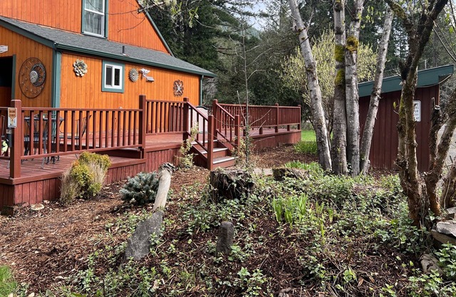 Tree-lined retreat with a wood stove, grill, firepit, & mountain views - dogs ok