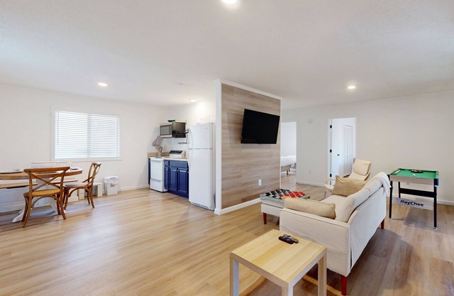 Updated tree-lined cabin with mountain view, and screened-in deck.