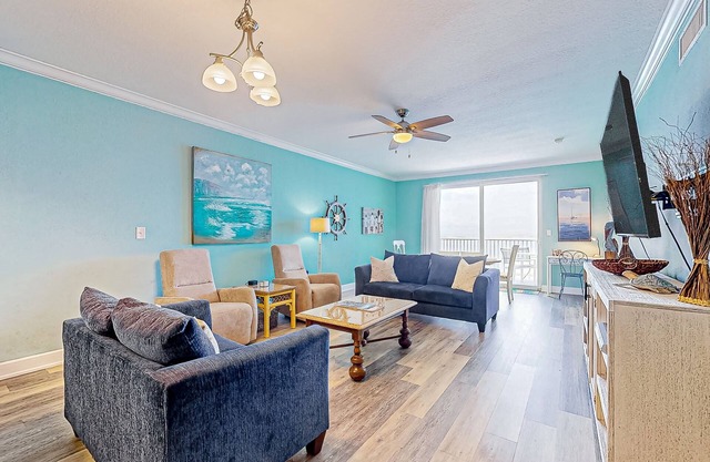 Waterfront condo with beach access, pools, balcony, central AC, & W/D