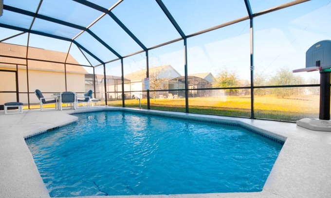 Sunset Ridge Casa | 4 dormitorios y 3 baños de vacaciones piscina casa con garaje. Orlando Florida.