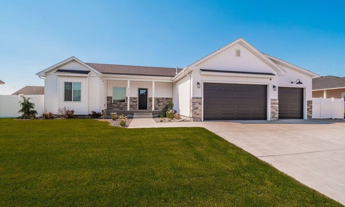 Idaho Falls Casa | 6 bed 3 bath home ~ sleeps 20! w/ game room, fireplace, hot tub & playground.