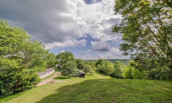 Sharpsburg Casa | 8700 Wood Rd, Chesterhill, OH - Property with a small cabin and a single family home