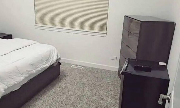 Oak Lawn Casa | A cozy bedroom in a home with high-tech amenities