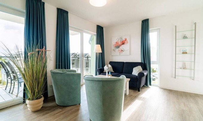 Schillig Apartamento | "Achtern Diek" - Holiday apartment with sea view and private sauna by the North Sea