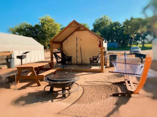Prairie Lea Otro | Adventurous Family Glamping Getaway: Amazing Safari Tent on the San Marcos River near Kingsbury, Texas with Kayaks, Canoes and More