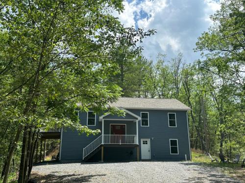 Great Cacapon Casa | All Decked Up - wifi, view, river access, fire pit, 3 bedrooms, games, family friendly