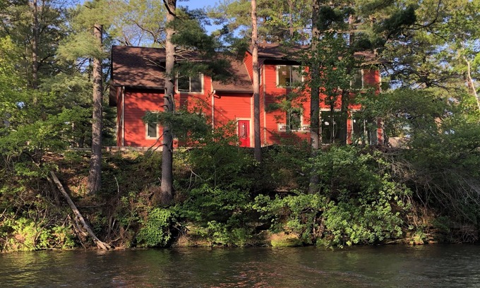 Tainter Lake Casa | Amazing River House with covered patio! Sleeps 10-14. Kayaks,Fireplace,Games.
