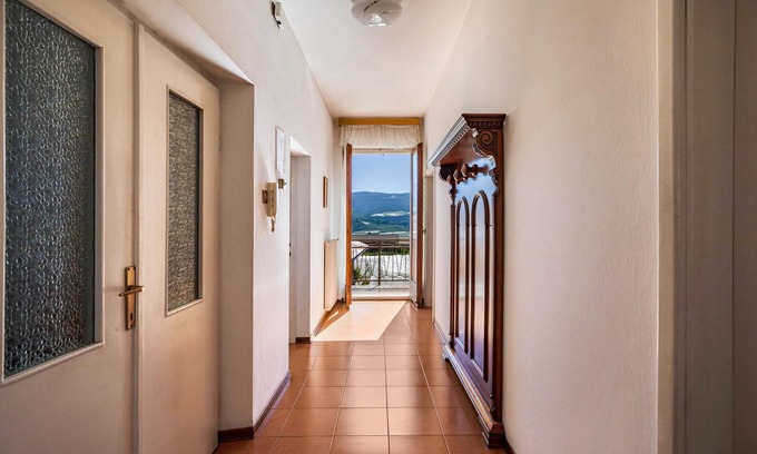 Tassullo Apartamento | Apartamento Melax con vistas a la montaña y jardín que admite mascotas