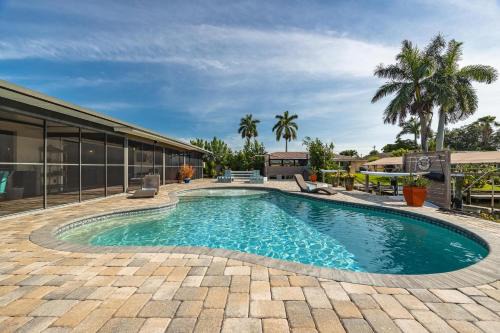 Caloosahatchee Casa | Aqua Escape - Cape Coral - Roelens Vacations Gulf Access- Minutes to the River- Kayaks-Dog Friendly