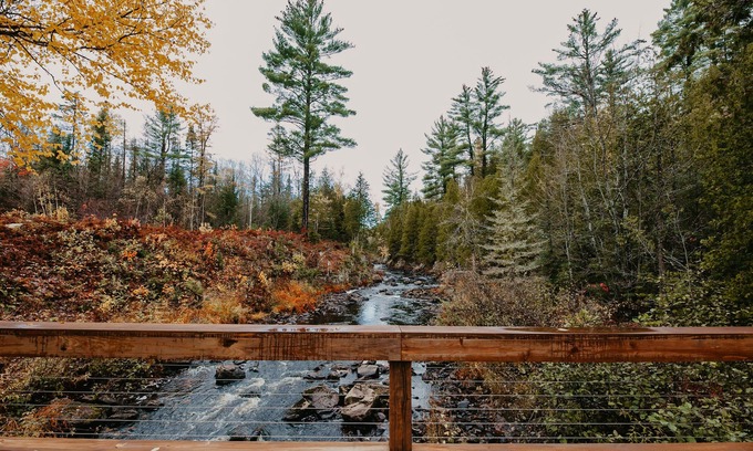 Champion Casa | ATV-Snowmobile Trail, Large home, sits on the peshekee river. sleeps 18 people.