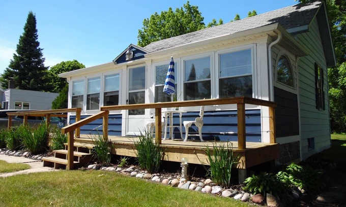Tawas City Casa | Bay House Location is perfect for a stroll down Newman Street across from Public Lake Huron Beach!