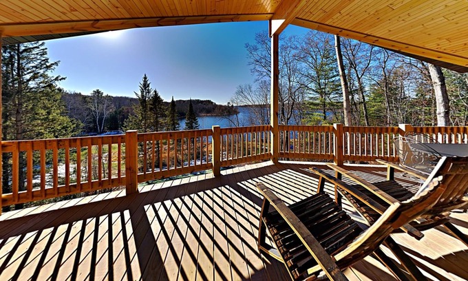 Chief Lake Cabina | Brand New 5 bedroom Lacourte Orellies lakefront home with covered deck and amazing lake views.