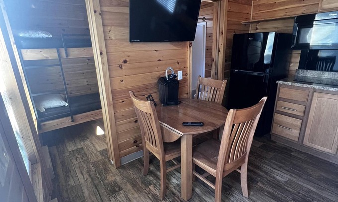 Dickerson Run Cabina | Cabin 4 - Stay like royalty. Sit on your concrete patio overlooking the beautiful Youghiogheny River.