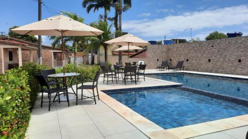 Pilar Casa | Casa 85 m2 no FORTE 2 quartos campinho piscinas 2 vagas no estacionamento portaria ar condicionado para 8 pessoas