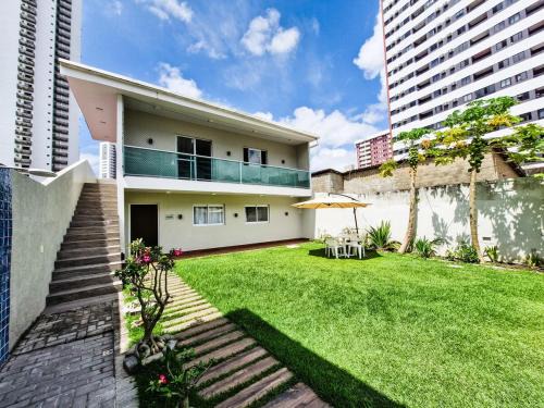 Madalena Apartamento | Casa moderna com jardim privativo