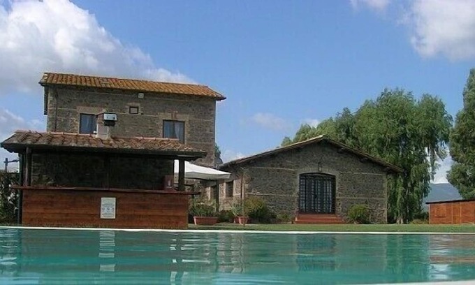 Padua Casa | Casa Pausania E: Un apartamento característico que forma parte de una antigua granja rodeada de viñedos y olivares.