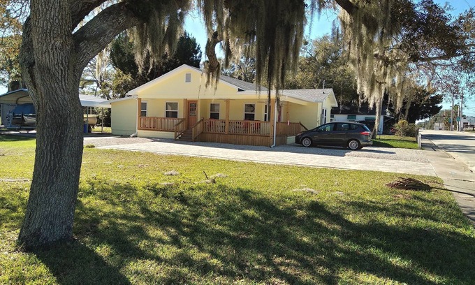 Edgewater Casa | Charming 3 bedroom 2 bath home w/ wraparound veranda on one acre of land.