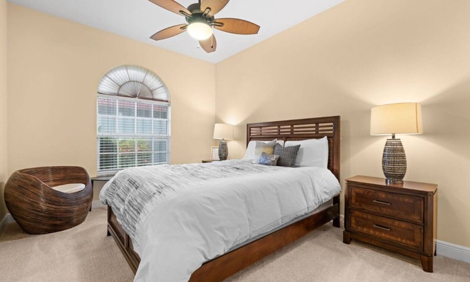 Waters Edge Casa | Charming 3-bedroom lake house in Fort Myers with screened-in pool & hot tub.