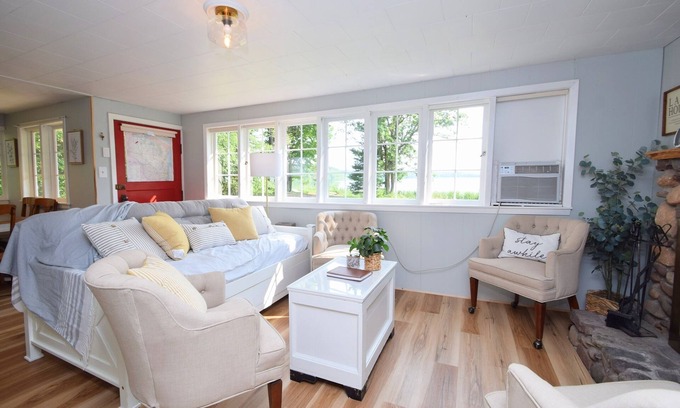 Webster Cabaña | Charming Lakeside Cottage nestled on 40 private, wooded acres on Big Sand Lake