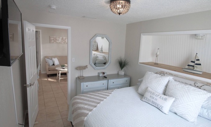 Dunedin Casa | Centro costero Dunedin Inicio con bicicletas y carrito de golf