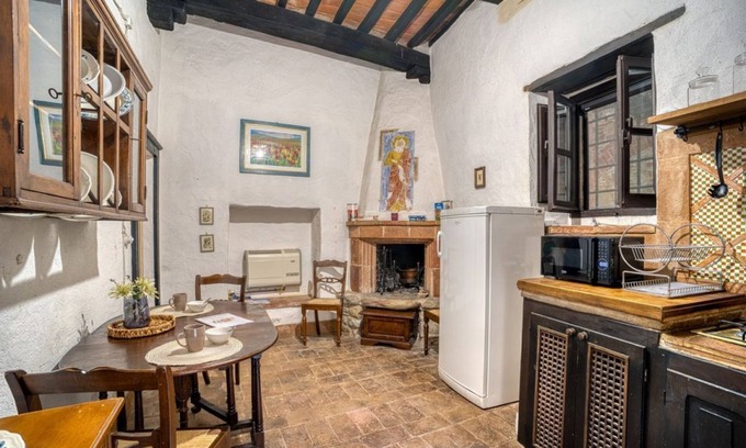 Magione Apartamento | Comfortable apartment located in a historic Abbey from the year 1000, restored in 1980.La Badia is a small Benedictine Abbey immersed in a park of centuries-old olive trees.Located on the ground floor, there is a mezzanine for the sleeping area.There are
