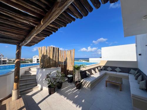 Luis Donaldo Colosio Apartamento | Condo Boho con Roof pool y vista al mar