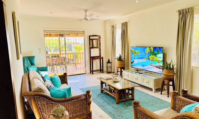 Atlantic Shores Cabaña | Cotton Bay Cottage @ Freights. Large sea facing garden. Family & Pet friendly