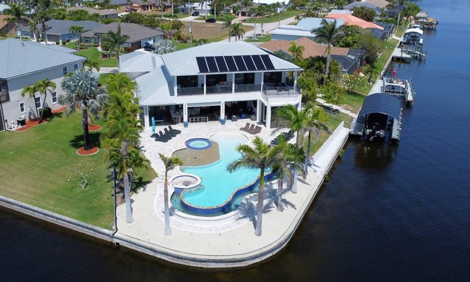 Pelican Casa | Dream Home Vacation! Stunning Waterfront! Luxurious Resort-Style Lagoon Pool, Spa & Outdoor Living!