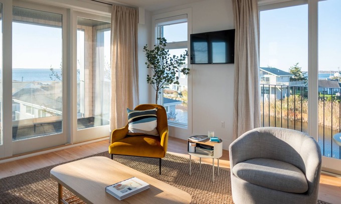 Falmouth Casa | Enjoy 180 degree views of the Vineyard Sound from this new modern beach house!