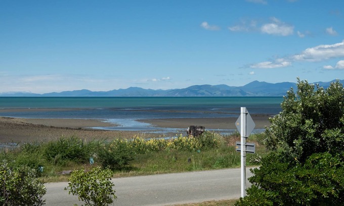 Tasman Cabina | Escape to the tranquil Helme Holiday Bottom Bach, kiwi charm on beautiful Kina Peninsula