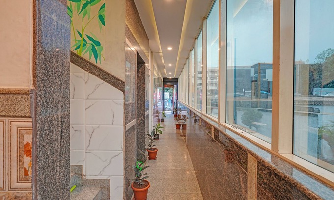 Hennur Gardens Hotel | Fabhotel Sapthagiri Suites Inn