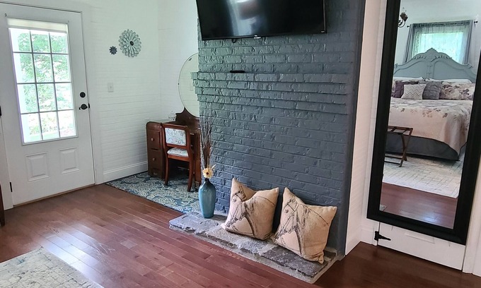 Vein Mountain Otro | Gorgeous farmhouse hot tub fire pit outside bar barn gameroom mountain views