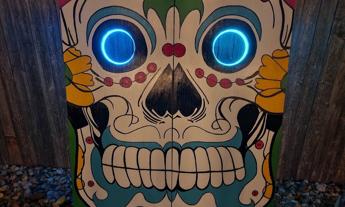 Harlandale Casa | Halloween House sugar skull corn hole, life size Checkers, Horseshoe, Foosball
