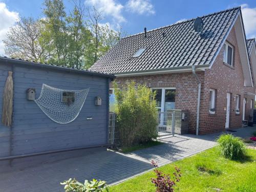 Dornum Casa | Haus Nordseeliebe mit Außensauna, Outdoor Dusche und Wallbox