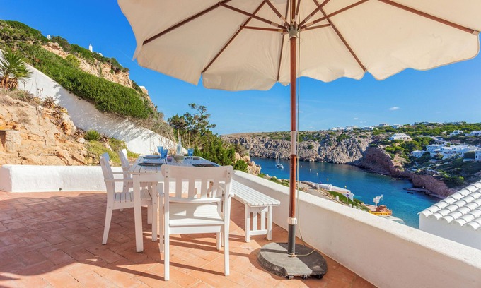 Ciutadella de Menorca Casa | Casa de vacaciones "Vacaciones en Cala Morell" que admite mascotas, con vistas al mar y jardín