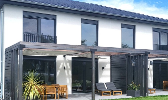 Pouch Casa | Casa de vacaciones 'Schlossterrassen 8b' con vistas al lago, terraza privada y Wi-Fi