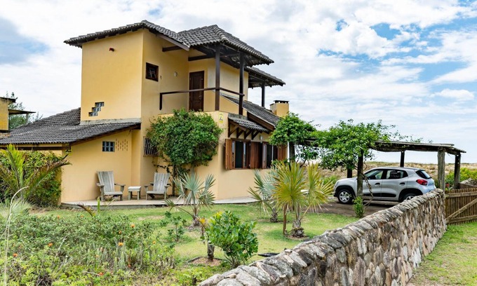 Barra de Ibiraquera Casa | casa en la playa con vistas espectaculares y un gran jardín