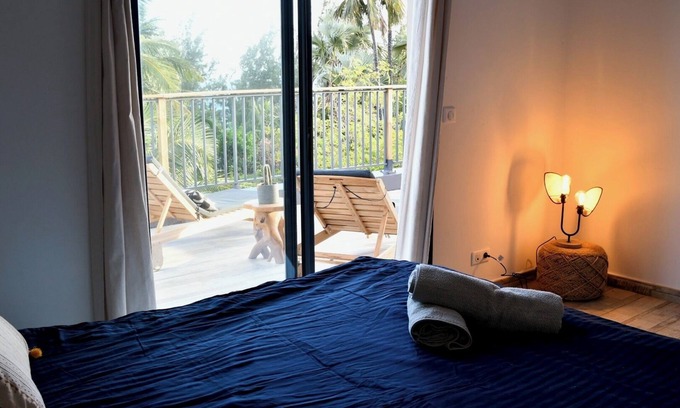 Manapany-les-Bains Casa | L'océan de Brilune Wake up among the palms, dine under the stars