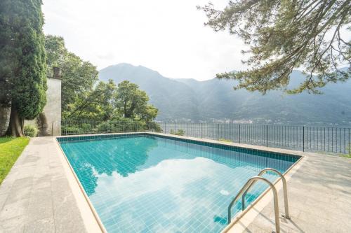 Nesso Apartamento | Lakefront apartment with a view, parking and swimming pool